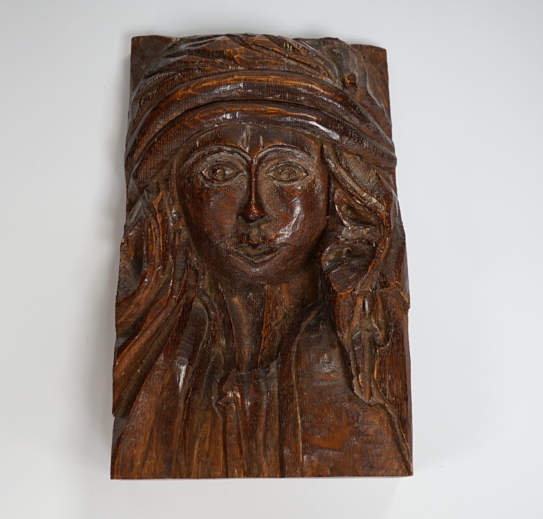 A small carved oak figure of a maiden, 28cms high